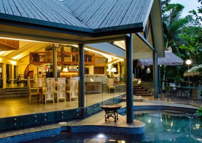 Evening view of the living space from the pool